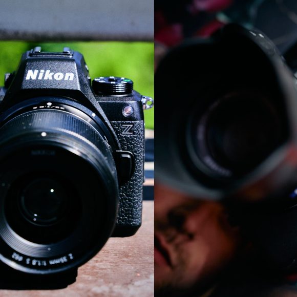 Side-by-side close-up of Nikon and Sony mirrorless cameras with lenses attached.