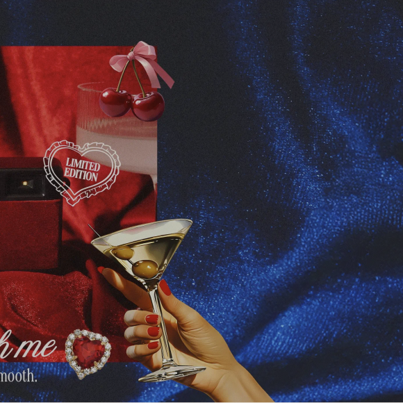 A red velvet camera, pearls, and a hand holding a martini; text: The Velvet Collection. Shop Now.